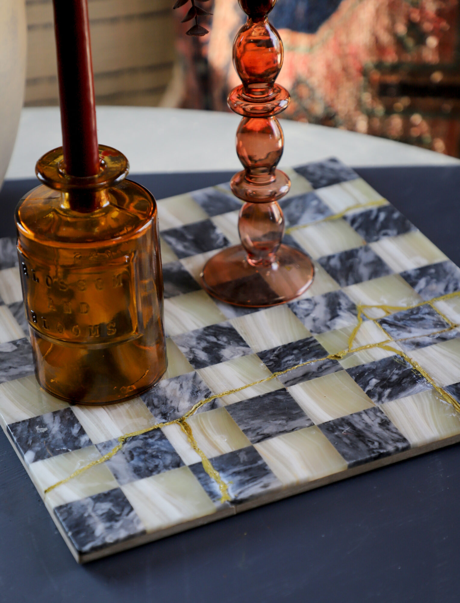 Beautiful repaired chess board with gold accents.